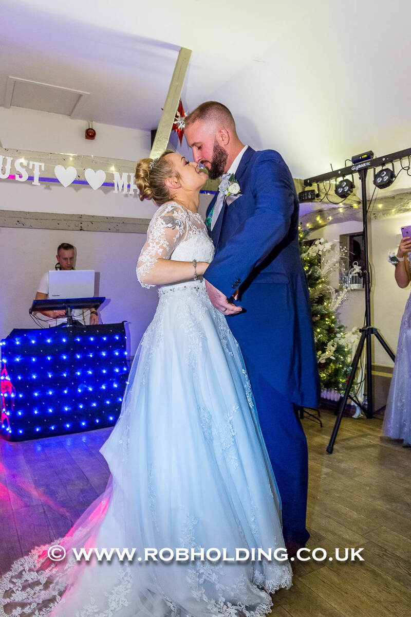 Bride and groom sharing a close dance moment