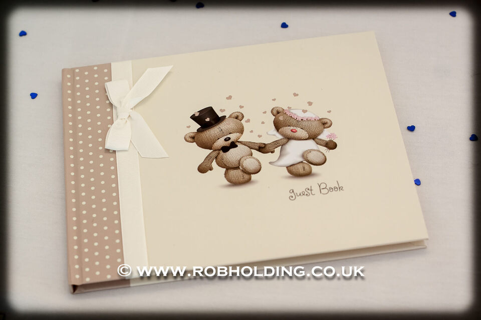 Wedding guest book with a teddy bear illustration on the cover