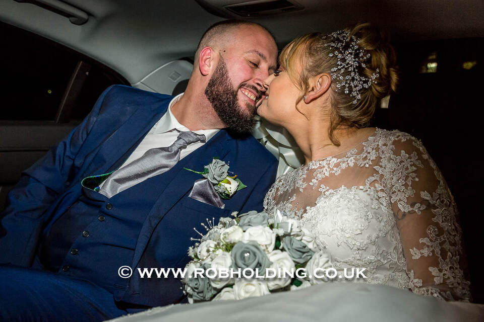 Groom and bride sharing a close, laughing moment together
