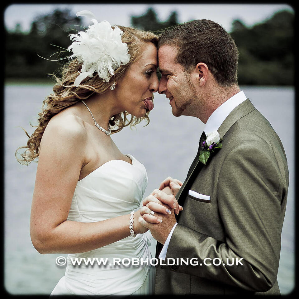 Close embrace between bride and groom outdoors
