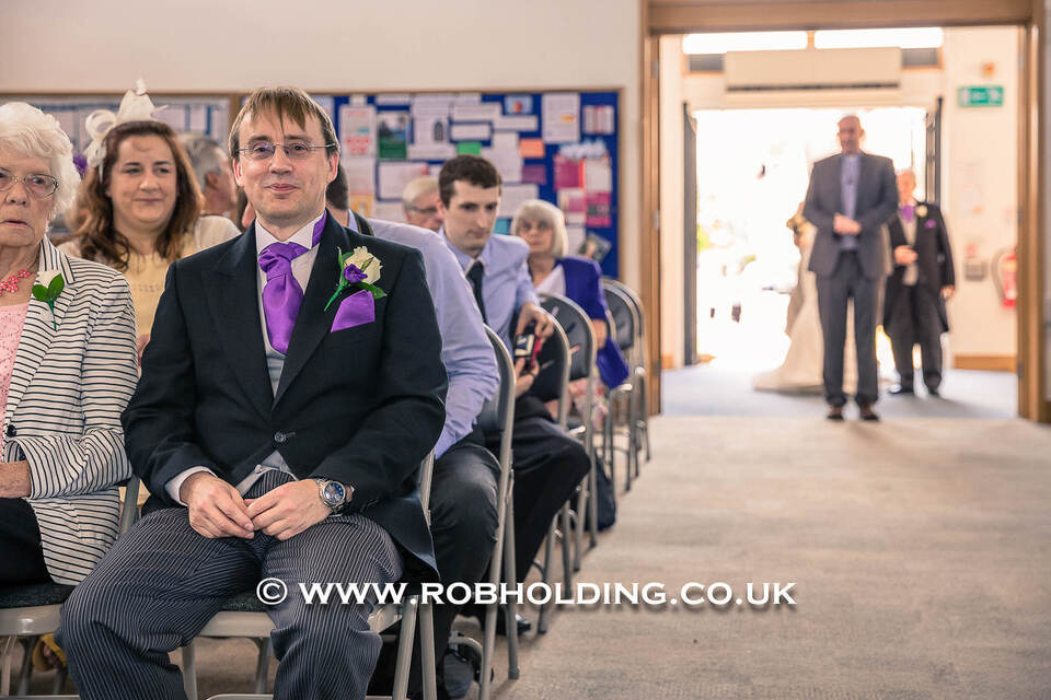 Wedding guests seated during the ceremony in a hall