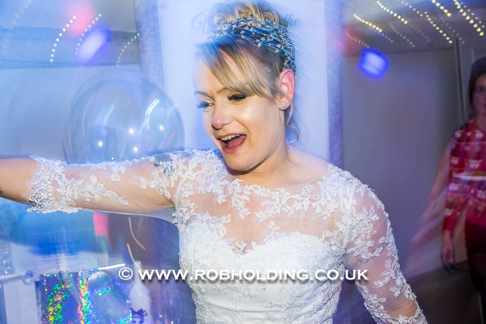Bride dancing and laughing at the reception