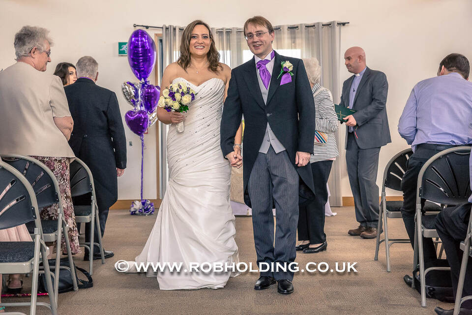 Bride and groom walking down the aisle