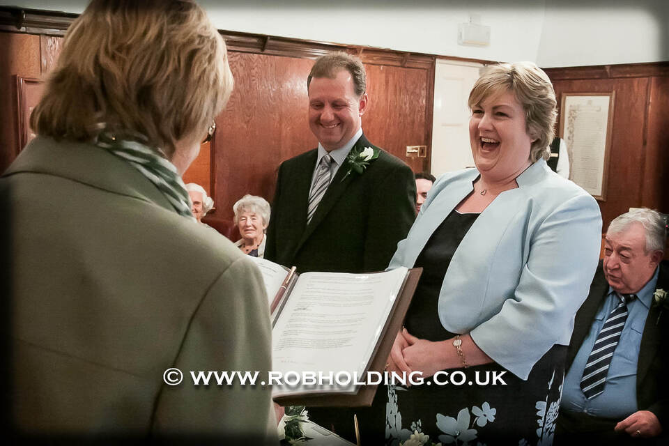 Guests reading together during the ceremony