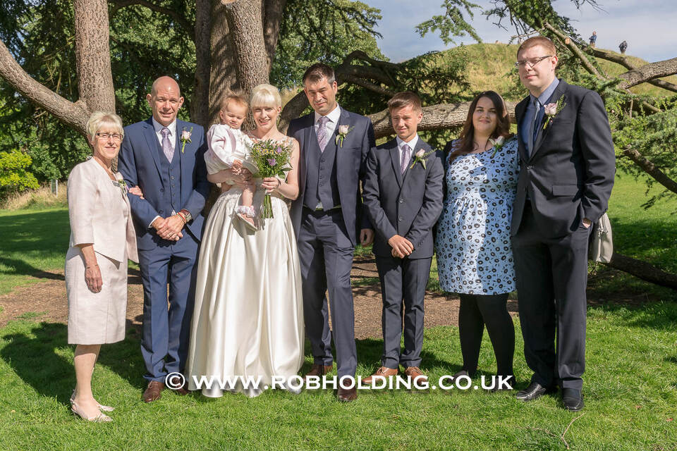 Family group photo outdoors on the lawn